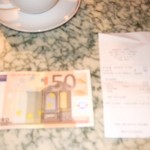 Trying to pay for Angelina with a 50 Euro note, proving (based on the look of chagrin on the waiter's face) that even busy places in France bound to have change don't like to make change.