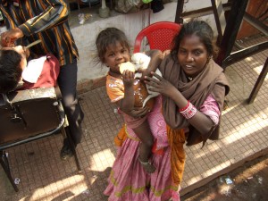 Beggar with a sympathy puppy.  It worked since we gave her the cracker she's eating.