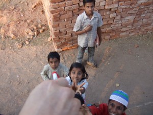 Handing a girl a pen from inside the bus while stuck in traffic on a country road.