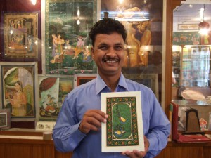 This the artist with the miniature painting he made for us - we selected=