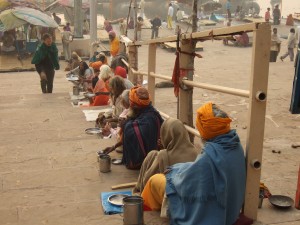 Beggars lining the ghatts down to the river