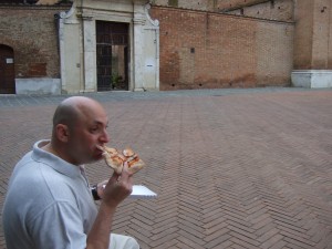 Enjoying the slice in the Piazza S. Francesco