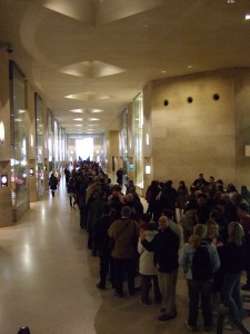 The line/queue to get into the Louvre, main entrance, on a free Sunday.
