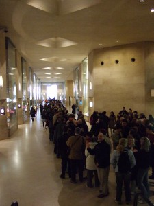 The line/queue to get into the Louvre, main entrance, on a free Sunday.