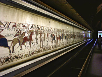 The Bayeux Tapestry -- When you view the tapestry you are given an audioguide and you walk your way around the world's most famous tapestry (which is, actually, an embroidery).  