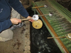 Washing our money at Zeniarai Benzeiten Shrine in Kamakura. It is said that when you wash your money it comes back to you many times over. We washed 605 Yen. A few days later we found 20,000 Yen on the ground.